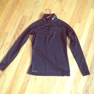 Nike Therma-Fit running top.